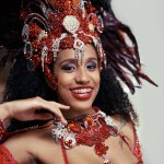 Samba, carnival or happy woman in costume or portrait for celebration, music culture or band in Brazil. Event, party or proud girl dancer with smile at festival, parade or fun show in Rio de Janeiro.