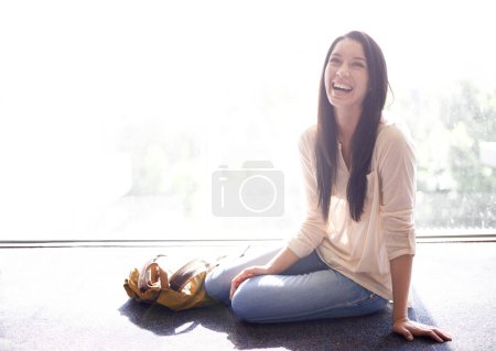 Photo for Woman, university and student with laugh for sitting on floor with backpack, campus and break for joke. Female person, education and college with happiness for fun, enjoy and academics to relax. - Royalty Free Image