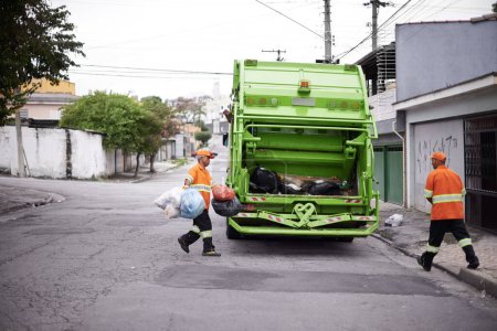 Photo for Garbage truck, junk and men with collection service on street in city for public environment cleaning. Dirt, recycling and male people working with waste or trash for road sanitation with transport - Royalty Free Image