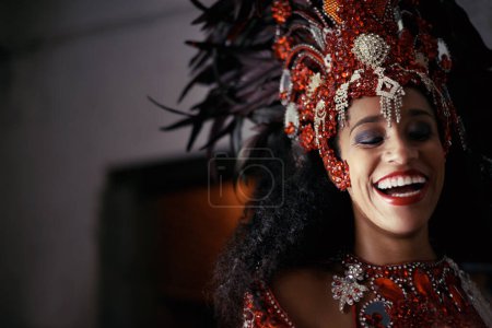 Face, samba and woman at carnival with costume in celebration of music, culture and happiness in Brazil. Dancer, party and laughing girl in fantasia at festival, parade or show in Rio de Janeiro