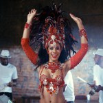 Smile, carnival or happy woman in costume or portrait for celebration, music culture or band in Brazil. Night event, party or girl dancer with energy at festival, parade or fun show in Rio de Janeiro.