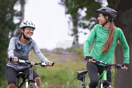 Photo for Happy woman, friends and forest with bicycle on field for outdoor cycling, workout or cardio exercise in nature. Female person, athlete or cyclist with smile in fitness for off road training on trail. - Royalty Free Image