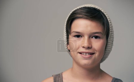 Photo for Boy, kid and beanie in studio for portrait with smile, mockup and space for fashion by background. Child, model and hat with trendy style, happy and pride for clothes with confidence for punk outfit. - Royalty Free Image