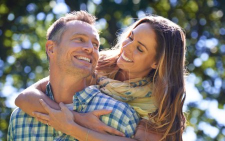 Photo for Romance, embrace and couple with smile in park for summer weekend, trees and fun outdoor date. Love, mature man and happy woman in garden with morning sunshine, hug and marriage bonding in nature - Royalty Free Image