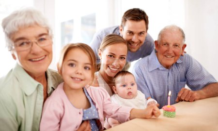 Photo for Family, portrait and birthday party, cupcake and candle to celebrate and happy people at home. Parents, grandparents and children with cake or dessert for anniversary and generations with smile. - Royalty Free Image