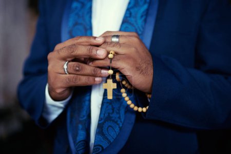 Photo for Hands, prayer with beads and Christian man in worship for religion, trust and spiritual hope with peace. Holy love, mindfulness and preacher faith for God praying with gratitude, rosary and cross - Royalty Free Image