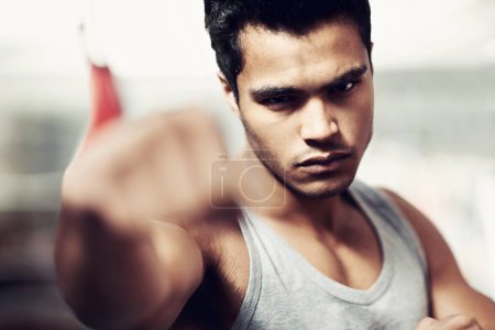 Photo for Man, portrait and boxing with confidence, fight and fists ready to punch in match for training and exercise. Male person, workout and cardio in gym, mma and boxer for sports and combat in vest. - Royalty Free Image