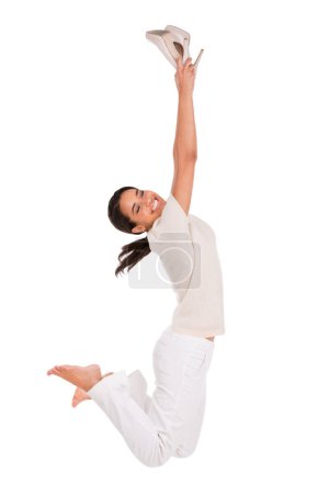 Photo for Fashion, jump and portrait of happy woman in studio with news, sale or shoes discount on white background. Wow, energy or female model with deal celebration, success or retail, shopping or mall promo. - Royalty Free Image