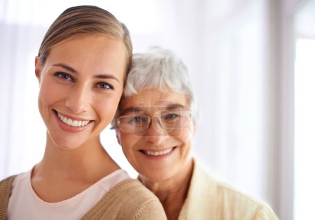 Photo for Senior woman, daughter and portrait with hug, pride and care for love, bonding and reunion in family home. People, elderly mom and mothers day celebration with connection, together and smile in house. - Royalty Free Image