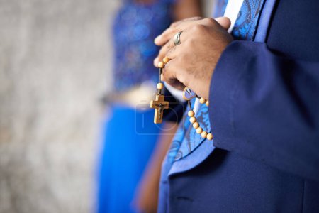 Photo for Man, hands and christianity with cross for religion, belief or praying of priest or preacher at church. Closeup of male person, christian or religious person with rosary beads for tradition or ritual. - Royalty Free Image