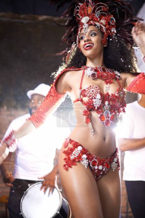 Photo for Black woman, dancing and samba with band at night for carnival season celebration in Rio de janeiro with sequins costumes. Female person, happy and fun at festival with unique fashion for culture. - Royalty Free Image