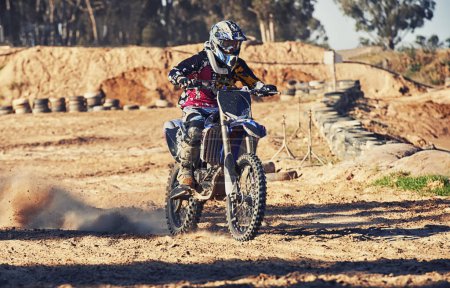 Photo for Motorbike, person and speed with dust cloud for games, contest or challenge in action for extreme sports. Racer, motorcycle and dirt on path, road and trail in nature with fast transport in summer. - Royalty Free Image