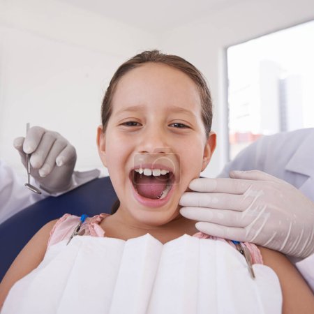 Photo for Child, mouth and portrait for dentist consultation for teeth examination for healthy oral care, whitening or cleaning. Female person, girl and face with hands for hygiene checkup, wellness or gums. - Royalty Free Image