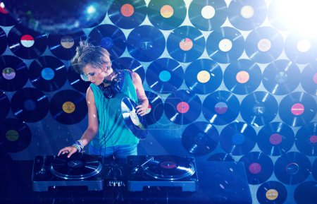 Photo for Woman dj, headphones and vinyl records in night club for party with turntable, lights and lens flare. Gen z female person, retro or mixing decks at event with energy, techno and music in Berlin disco. - Royalty Free Image