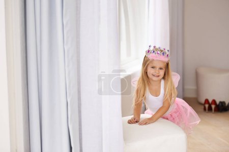 Photo for Princess, costume and portrait of girl in home for fun, playing and pretend for happy kids game. Fantasy, fashion and child in creative fairy fancy dress with wings, tiara and smile in bedroom - Royalty Free Image
