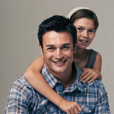Photo for Happy father, portrait and child with hug for love, care or support in fashion on a white studio background. Face of dad, son or kid with smile in casual clothing or trust for parenting or bonding. - Royalty Free Image