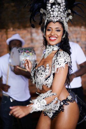 Photo for Dancer, carnival and woman with performance, portrait or pride for culture in group, music or band in night. Girl, smile and men dancing at event, party and celebration with drums in Rio de Janeiro. - Royalty Free Image