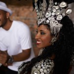 Happy woman, samba dancer and concert with band for performance at carnival or festival. Face of Brazilian female person or exotic performer with smile or cultural fashion for dancing or party in Rio.