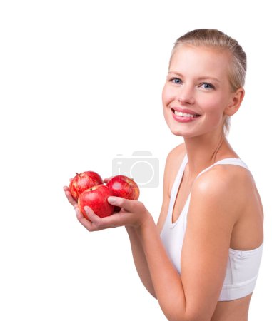 Photo for Happy, woman and portrait with apple for nutrition benefits in diet on white background in studio. Girl, smile and eating fruit for detox of digestion and food with vitamin C and fiber for gut health. - Royalty Free Image