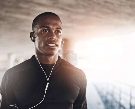 Photo for Man, face and music for fitness outdoor with thinking, listening to podcast and exercise for healthy body. Athlete, african person and earphones with audio, radio and sound for workout and training. - Royalty Free Image