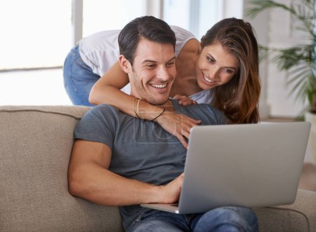 Photo for Laptop, smile and woman hugging man on sofa networking on social media, website or internet. Happy, love and female person embracing husband reading online blog with computer in living room at home - Royalty Free Image