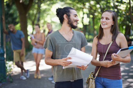 Photo for Students, friends and learning or talking on campus with education, knowledge and notebook or notes at college. Happy people with outdoor conversation, park and university for studying collaboration. - Royalty Free Image