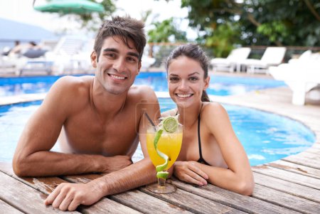 Photo for Swimming pool, cocktail and couple with portrait, summer and weekend break with vacation and honeymoon. Sunshine, man and woman with tropical drink and love with holiday and luxury with celebration. - Royalty Free Image