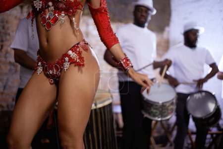 Photo for Woman, dancer and samba for carnival and music festival or street performance with costume closeup. Body of person dancing with drums for event, tourism and celebration or culture in Rio de Janeiro. - Royalty Free Image