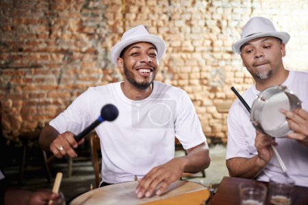 Photo for Happy, man and music on drums for carnival, festival or performance with band at party. Night, club and musician smile in portrait with instrument for playing creative samba or salsa beat with rhythm. - Royalty Free Image