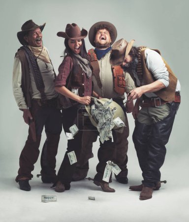Photo for People, cowboys and happy for bank robbery in studio mockup, outlaw and wild west character with pistol. Texas, men or woman for money with weapon or vintage clothes or costume by white background. - Royalty Free Image