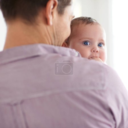Photo for Family, baby and face with dad in home with love, support and care together with parent and bonding. Relax, father and happy in a house with hug of calm infant with childcare and thinking with youth. - Royalty Free Image