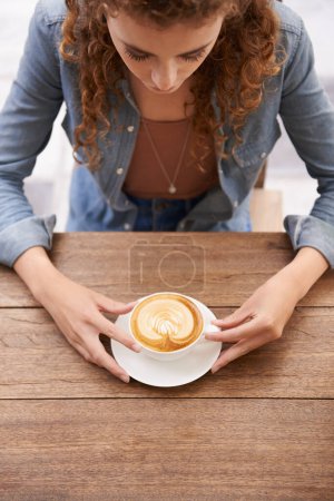 Photo for Woman, top view and coffee at a cafe, restaurant and diner with tea cup, latte and espresso for drinking, break and relaxation. Female adult, hot beverage and table at canteen, bistro or cafeteria. - Royalty Free Image