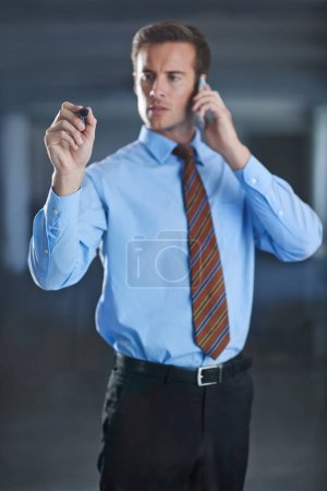 Photo for Businessman, planning and writing on glass with pen for notes of phone call, ideas or strategy for future. Virtual, communication and man problem solving on window or screen in workplace with contact. - Royalty Free Image