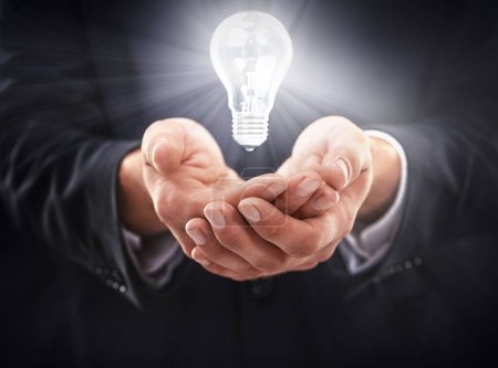 Photo for Hands, light bulb glow and idea for business growth, development and professional problem solving. Person with insights, corporate innovation and knowledge with enlightenment and inspiration. - Royalty Free Image