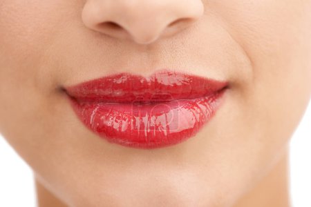 Photo for Person, red lipstick and closeup of smile with makeup in cosmetics, gloss or glow in treatment. Colorful lips of woman or model in satisfaction for mouth, oral or beauty in cosmetology or dermatology. - Royalty Free Image