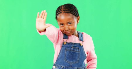 Photo for Stop, green screen and child with angry hand gesture for authority isolated against a studio background. Girl, frustrated and serious kid with a problem and no sign, signal and warning expression. - Royalty Free Image