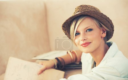 Photo for Portrait, woman and relax on sofa for travel planning for rest and leisure in home in Australia. Happy female person, couch and smile to contemplate tourism idea of break, weekend and getaway. - Royalty Free Image