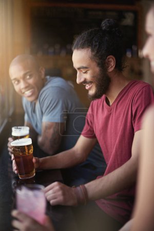 Photo for Friends, men and smile in pub with beer for happy hour, relax or social event with window view. Diversity, people and drinking alcohol in restaurant or club with happiness for bonding and celebration. - Royalty Free Image
