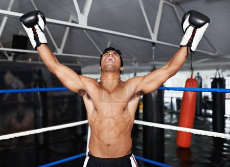 Photo for Boxer, man and gym with celebration, boxing ring and smile for workout or training. Person, exercise and fitness for health, wellness and achievement or winning with cardio for professional fight. - Royalty Free Image