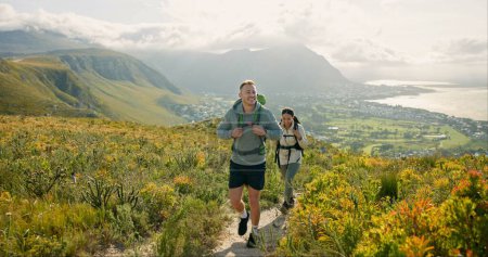 Photo for Couple of friends walking, hiking on mountain and travel for fitness, adventure or journey in nature for wellness. Young people trekking with backpack on a path or green hill for cardio and health. - Royalty Free Image