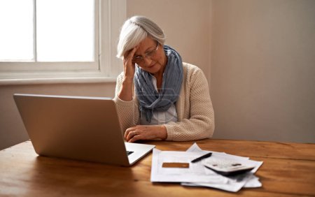 Photo for Senior woman, stress and laptop for bankruptcy in home, worry and paperwork for tax return or insurance. Elderly female person, frustrated and document for retirement plan, fail and mistake in budget. - Royalty Free Image