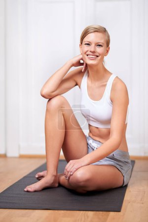 Photo for Happy woman, portrait and relax with yoga mat for exercise, training or health and wellness at home. Face of female person, blonde or yogi with smile for pilates, fitness or workout on floor at house. - Royalty Free Image