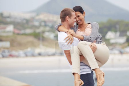 Photo for Smile, love and man carrying woman in street with support, activity and date on vacation in Mexico. Road, couple and happy with embrace in city for romance, travel and adventure on holiday together. - Royalty Free Image