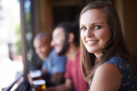 Photo for Portrait, happy and a woman at pub to relax, cheerful or positive facial expression for leisure at restaurant tavern. Face, bar and smile of young female person or casual customer at cafe for alcohol. - Royalty Free Image