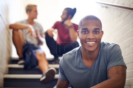Photo for Black student, friends and happy with portrait on staircase for conversation at recess, break and campus. People, talking and relax on steps in hallway at university between lecture or study class. - Royalty Free Image