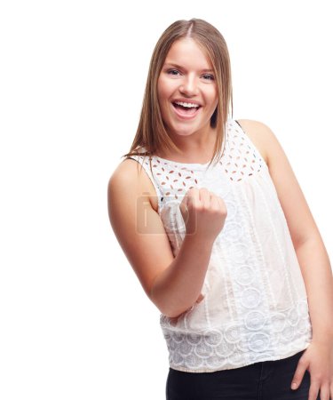 Photo for Woman, winner and fist for portrait in studio with success, goal or happy by white background. Person, girl and smile with celebration, cheers or excited for achievement, giveaway or prize in contest. - Royalty Free Image