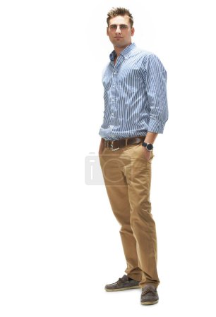 Photo for Portrait, man or confidence for fashion, style or clothes in outfit on white background in apparel, wardrobe or trendy. Male person, model or face in studio with shirt, trousers and stylish in Canada. - Royalty Free Image