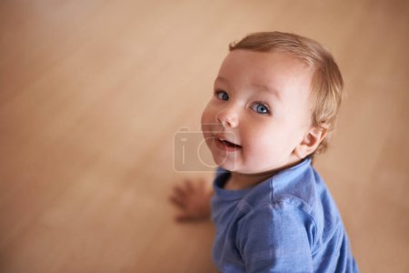 Photo for Boy, baby and smile for curiosity on floor, joy and kid to relax in living room on weekend. Child development, happy toddler and calm or comfortable, wellness and mockup space for health and growth. - Royalty Free Image