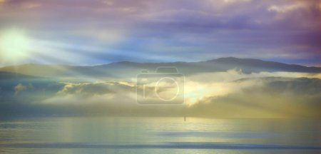 Ocean, sunset and sand with sunlight on island and tourist destination for summer vacation in nature. Blue sky, clouds or neon color on torrey pines beach, landscape or outdoor travel in california.