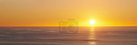Ocean, sunset and sun on horizon on tropical island and tourism destination for summer vacation in nature. Blue sky, clouds and golden sky on torrey pines beach, landscape and sunshine for salutation.